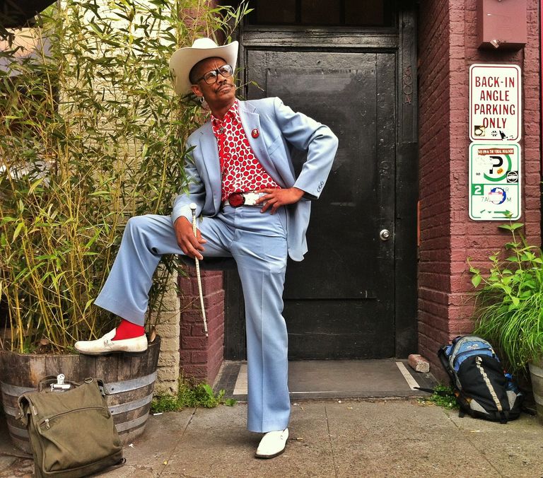 Man with cowboy hat and suit