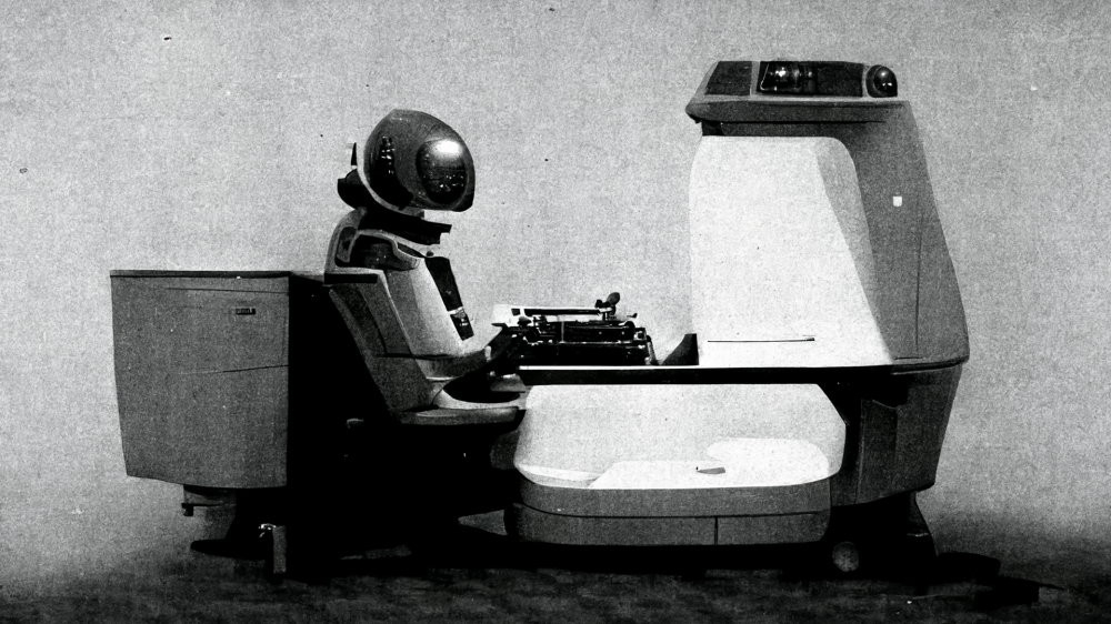 A round robot typing on a typewriter